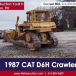Gul Caterpillar D6H schaktmaskin vid en maskinauktion online.