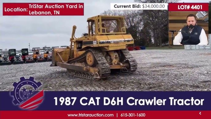 Gul Caterpillar D6H schaktmaskin vid en maskinauktion online.